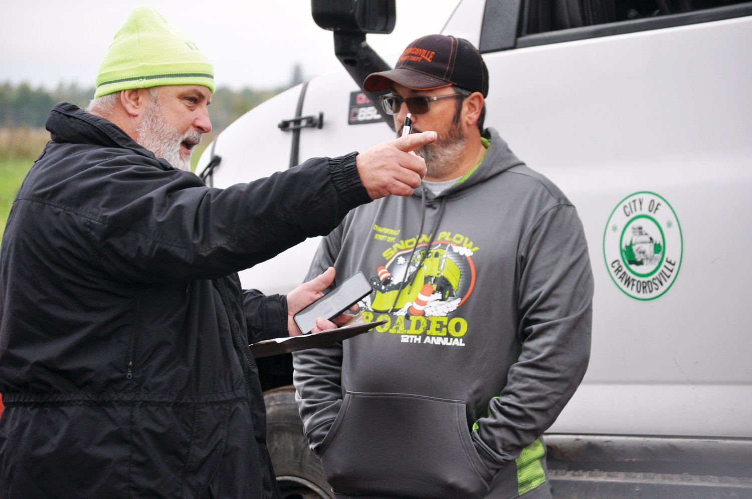 Rich Domonkos, program manager of Purdue University’s Local Technical Assistance Program, gives course instructions to Chris Hartman at the Crawfordsville Street Department’s Snow Plow Roadeo at the Rodney L. Jenkins Memorial Yard Waste Site on Thursday.