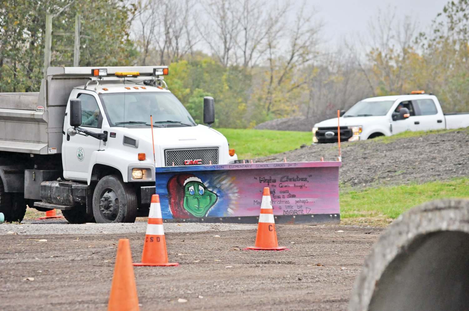 A snow plow driven by Chad Hodges maneuvers the course at the Crawfordsville Street Department’s Snow Plow Roadeo on Thursday at the Rodney L. Jenkins Memorial Yard Waste Site. The event trains drivers for plowing city streets.