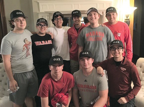 Theta Delta Chi brothers gather after collecting pledges in a previous campaign.