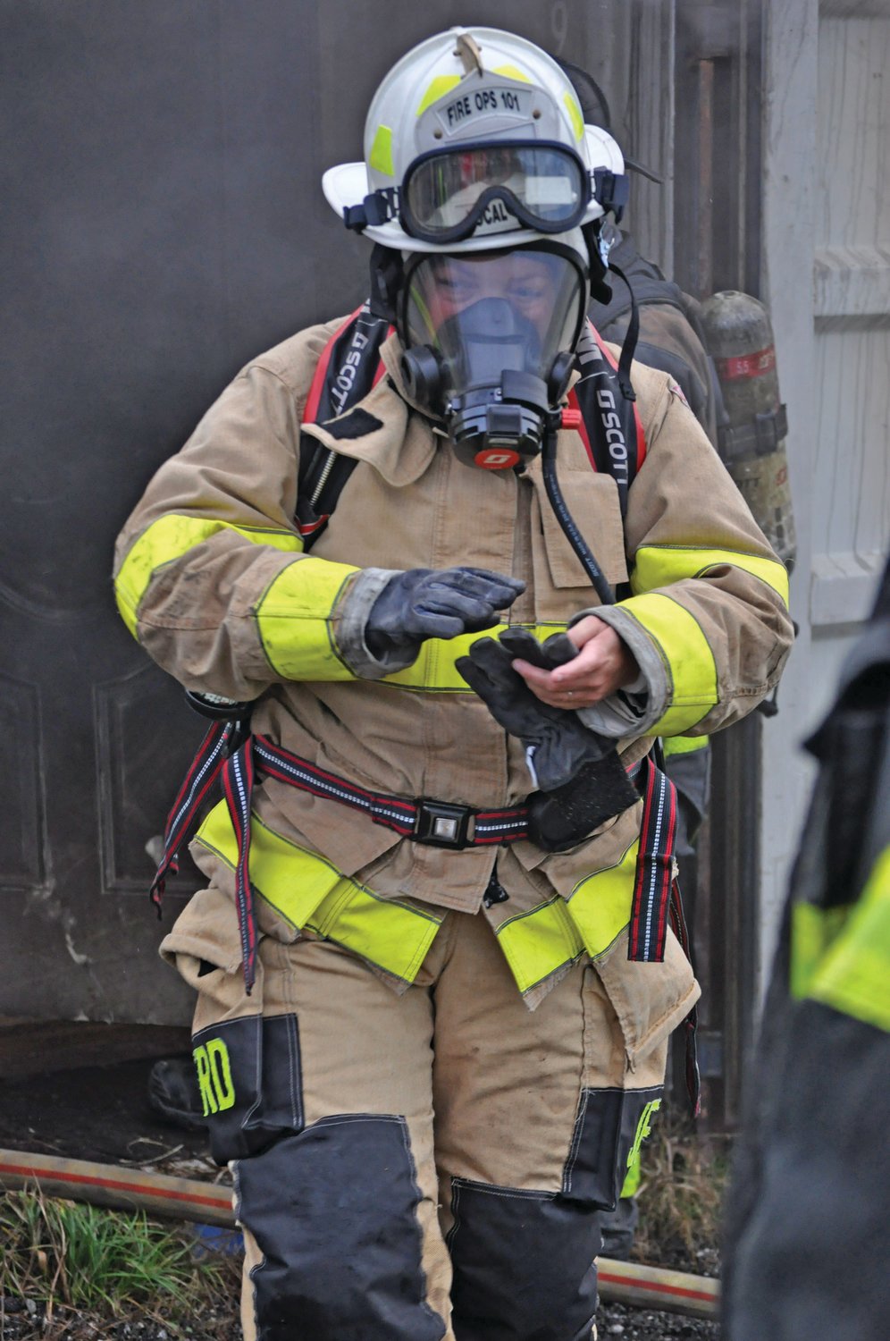 Ripley Township Trustee Jamie Selby emerges from a simulated fire at the Crawfordsville Fire Department