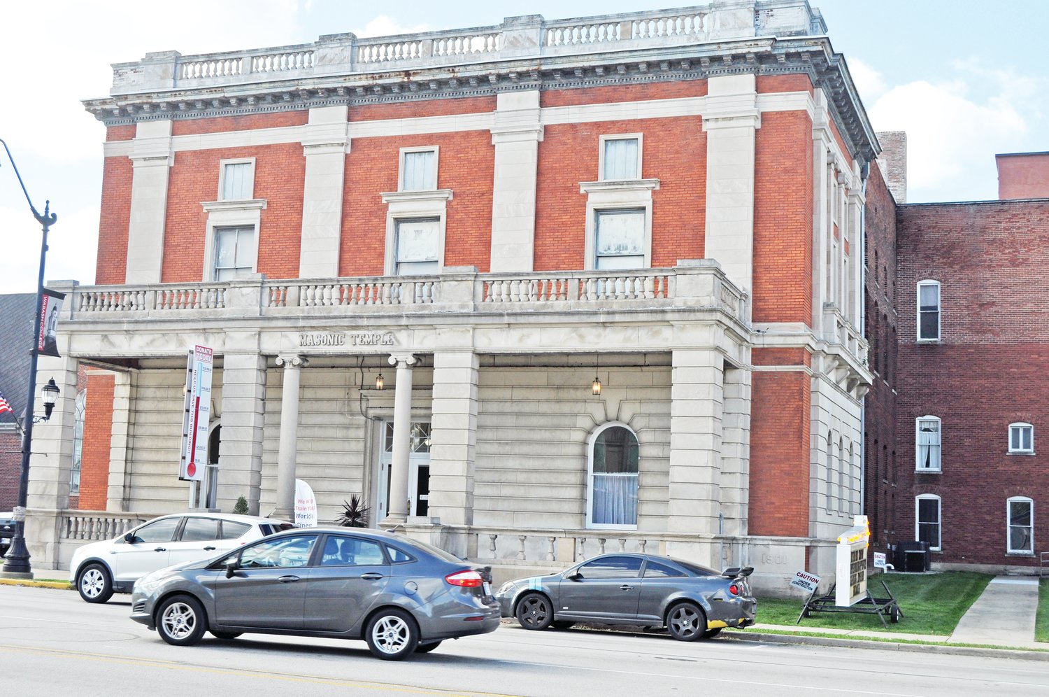 Cars drive past the Masonic Cornerstone Grand Hall and Event Center on Tuesday. The building is nearing historic district status from the City of Crawfordsville.