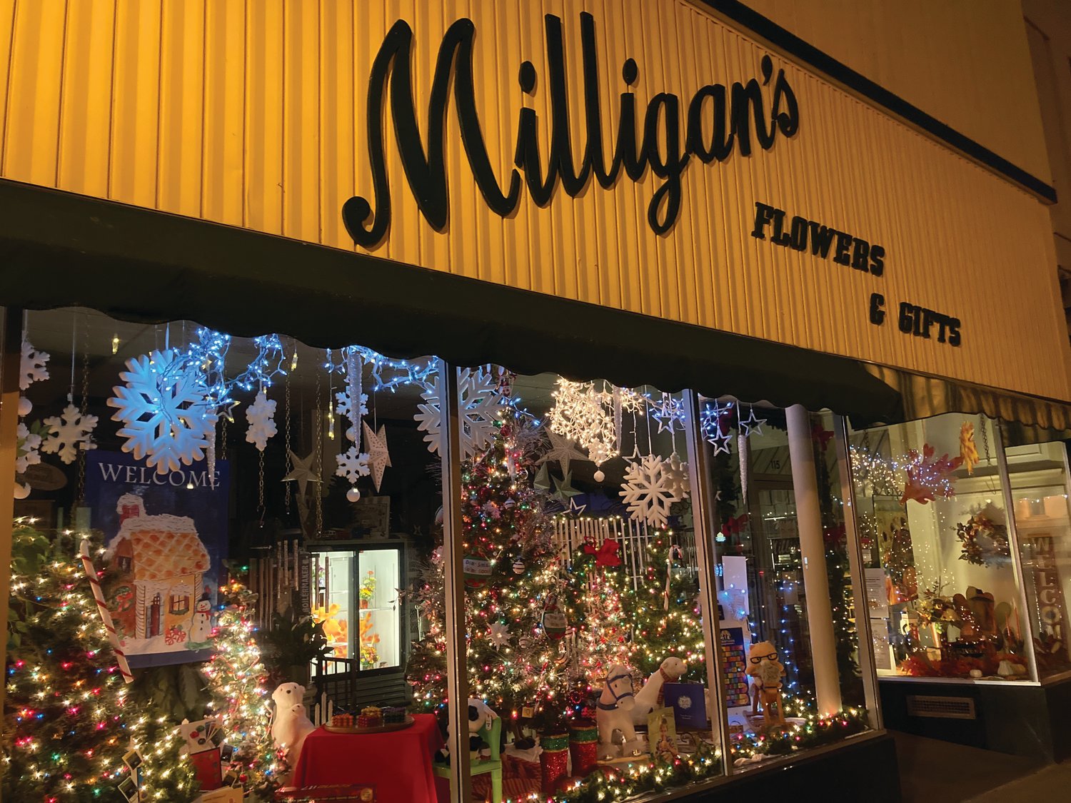 The window at Milligan's Flowers & Gifts in downtown Crawfordsville is decked out for the holiday window decorating contest.