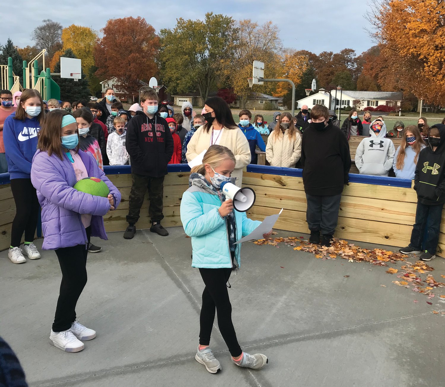On Monday, the Hoover Elementary Student Council hosted a dedication ceremony for the newly added handicapped accessible Gaga pit to the school playground. Gaga is known as a gentler version of softball and combines the skills of dodging, striking, running and jumping, while trying to hit opponents below the knees with a ball. Student Council President Maddie Biddle (holding megaphone) gave a short speech thanking fundraiser supporters, parents, staff and Kettlehut Construction for all of their combined time and financial support of the project. After the dedication speech, Hoover Student Council representatives were tasked with playing the first official game.