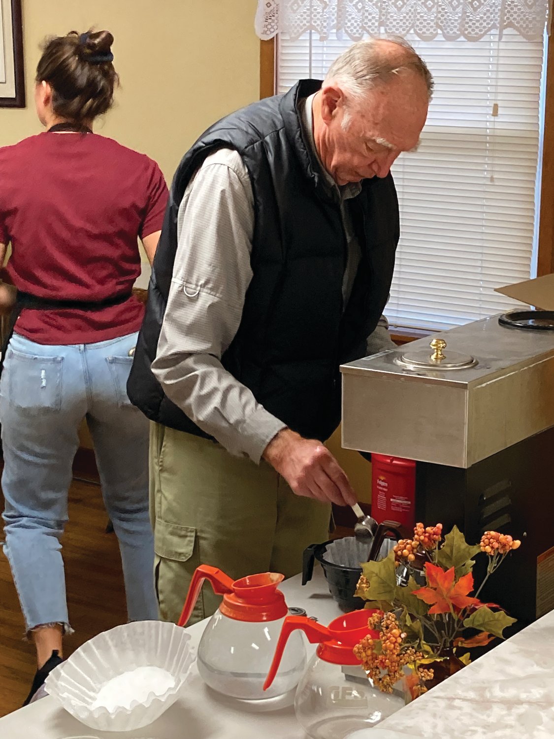 Larry Hulse makes coffee for the annual community Thanksgiving dinner on Saturday at the New Market United Methodist Church.