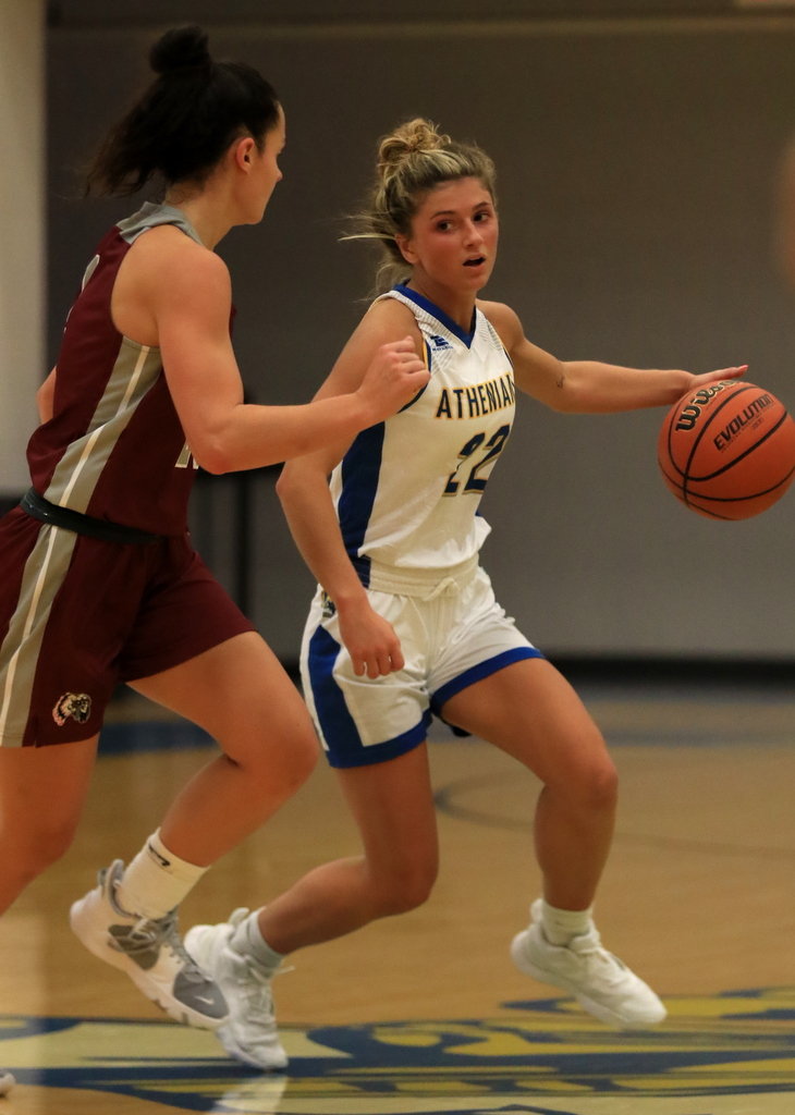 Shea Williamson sizes up her defender during the Athenians 54-30 loss vs Danville on Saturday.