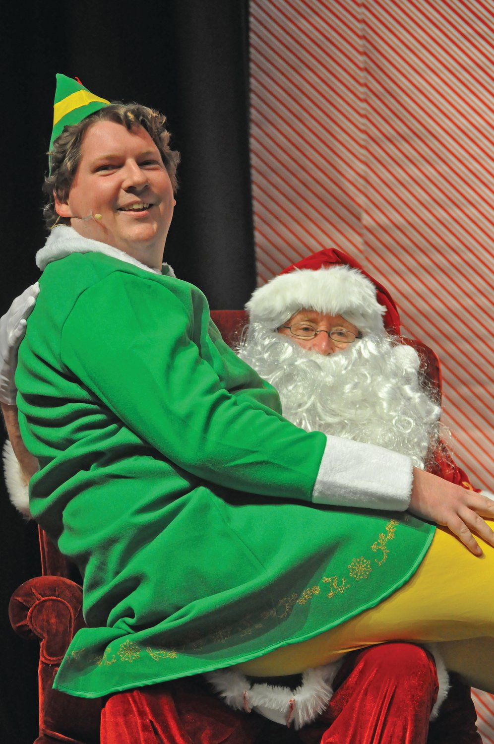 Brian Swick (Buddy) sits on Santa