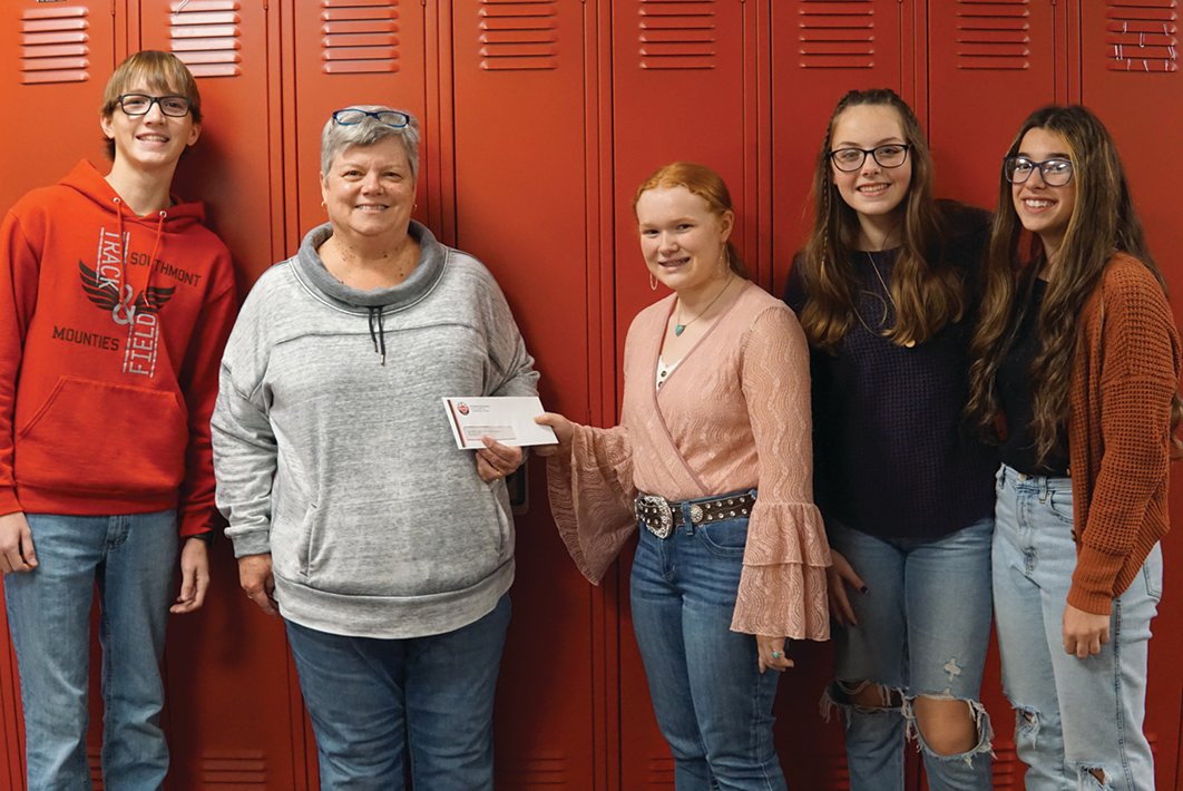 Southmont Jr. High School students presented a donation to Karen Branch, Montgomery County Youth Service Bureau executive director.  National Junior Honor Society members raised money through service projects to benefit the programs at YSB. From left are Gavin Downey, Branch, Sophia Shannon, Haylee Hall and Kendall Priebe.