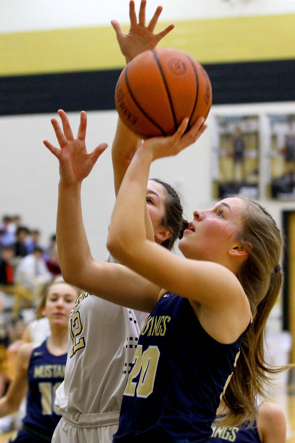 Hannah Prickett of Fountain Central going up for a lay-up as Briley Peyton of Covington closes in.