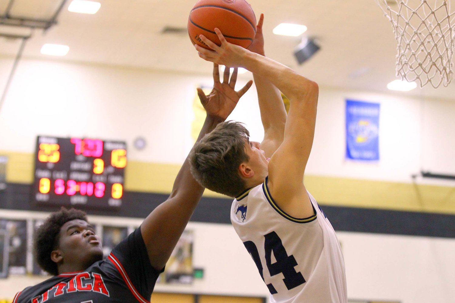 Isaac Gayler of Fountain Central shoots a lay-up after getting past Jamairie Johnson of Attica.