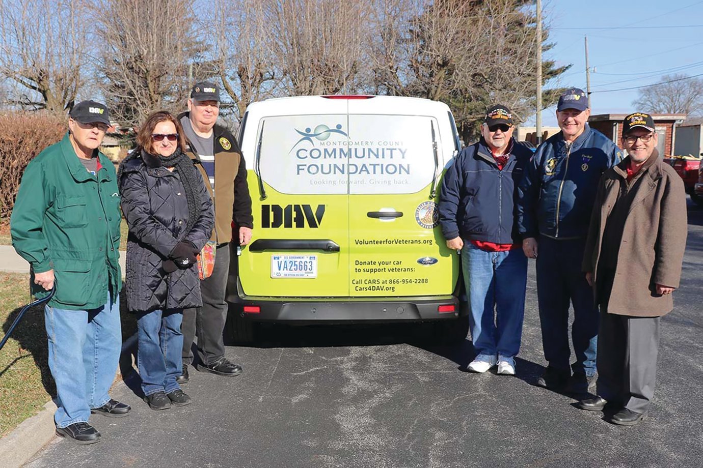 Montgomery County Veterans Service Officer Joe Ellis, third from right, celebrates the arrival of a new transport van Friday alongside representatives of Disabled American Veterans, Tri County Bank and Trust, Hoosier Heartland State Bank and the Montgomery County Community Foundation. The van will be used to transport area veterans to other VA centers in the region, including those in Lafayette, Brownsburg and Indianapolis.