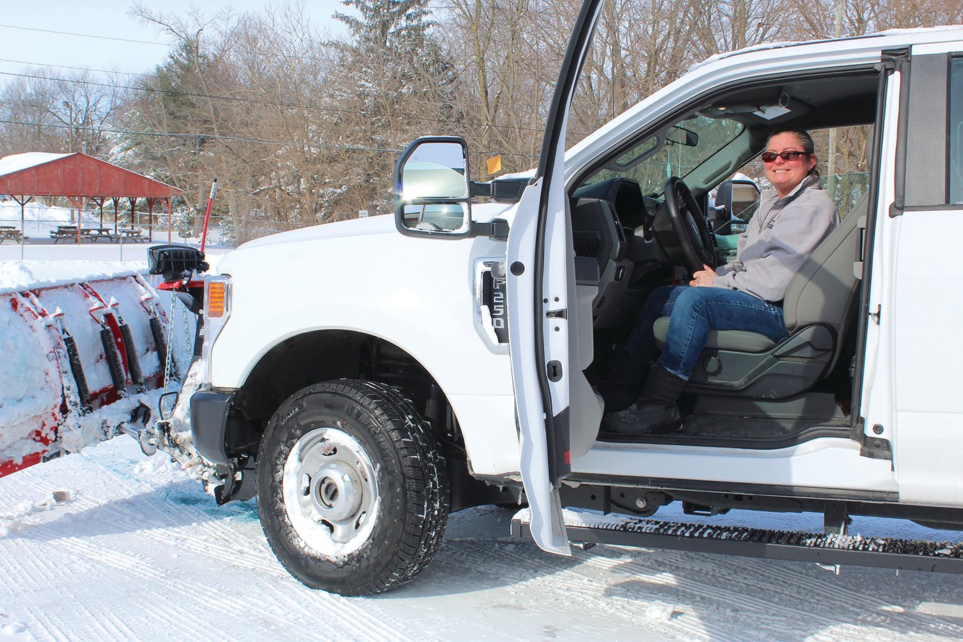 Kim Caldwell with the Parks and Rec Department plows the community center parking lot Friday.