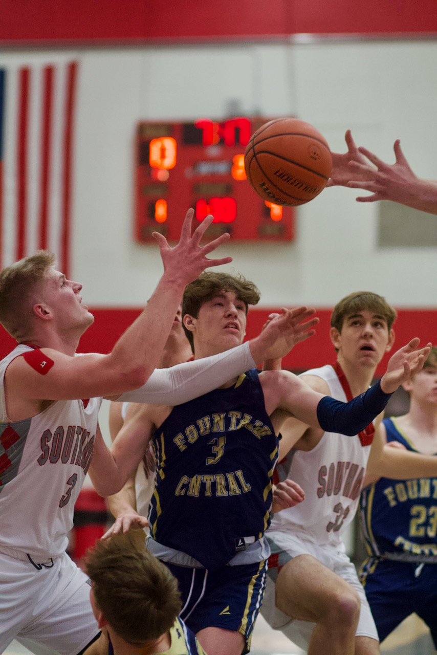 A cluster of Mounties and Mustangs fight for the loose ball.