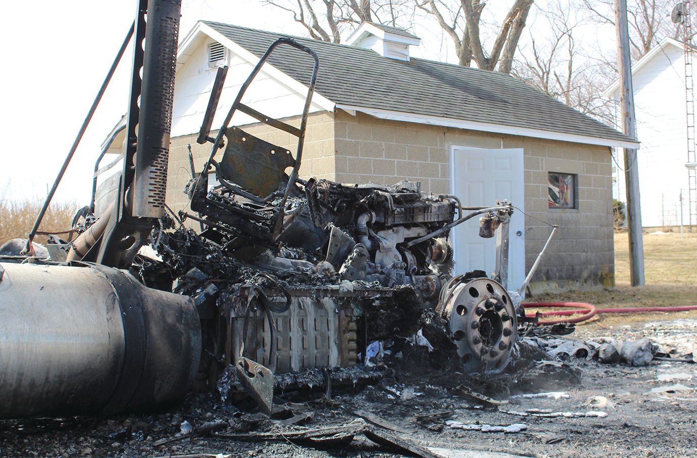 A Wednesday morning fire which destroyed a semi tractor sits within feet of other structures and farm equipment.