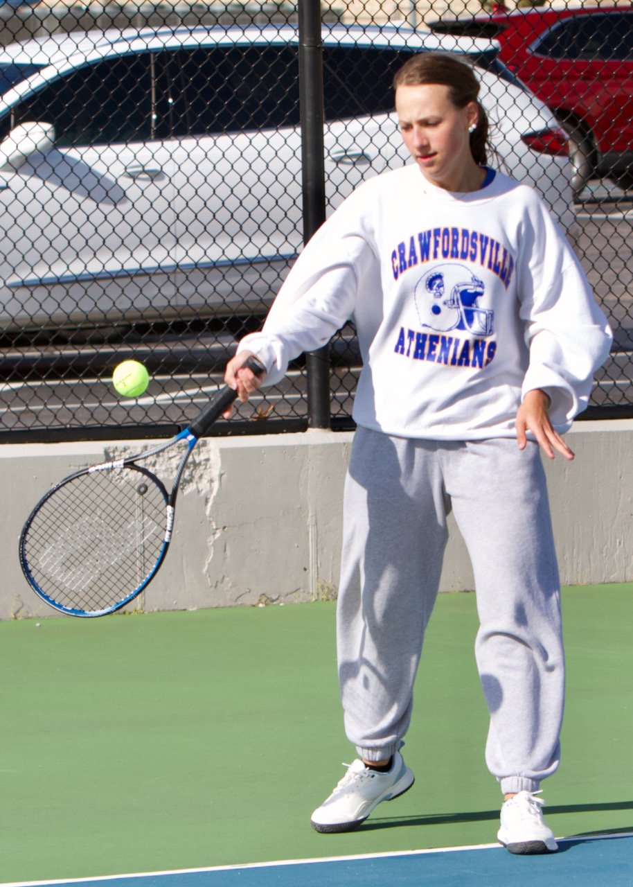 Reese Minette returns a hit at No.2 singles for CHS.