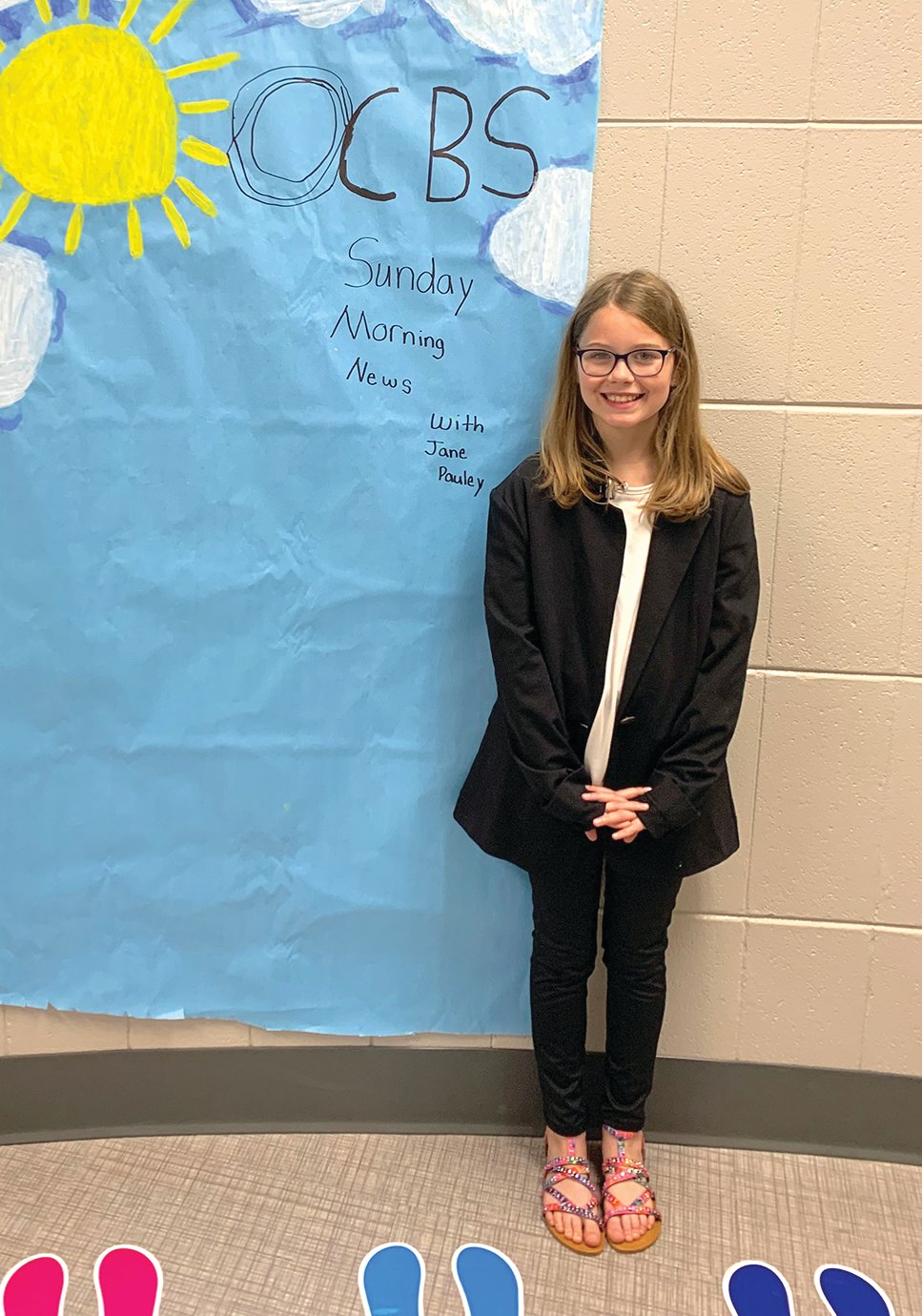 Fourth-grade Pleasant Hill student Savanah Ratcliff shows off her best impression of a wax figure of Sunday Morning News anchor Jane Pauley at the school Friday. Several fourth graders at Pleasant Hill researched and presented themselves as wax figures for the school