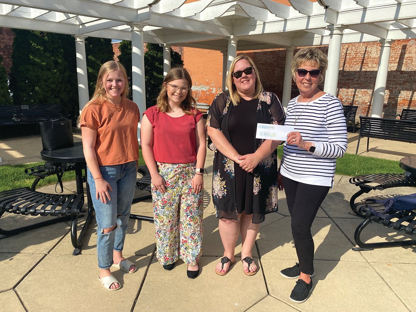 Representing Camp Milligan, the Montgomery County Community Foundation and Crawfordsville Parks & Recreation via check presentation Monday were Marley Dyson, from left, Amy Hutchison, Lisa Walter and Joyce Grimble.