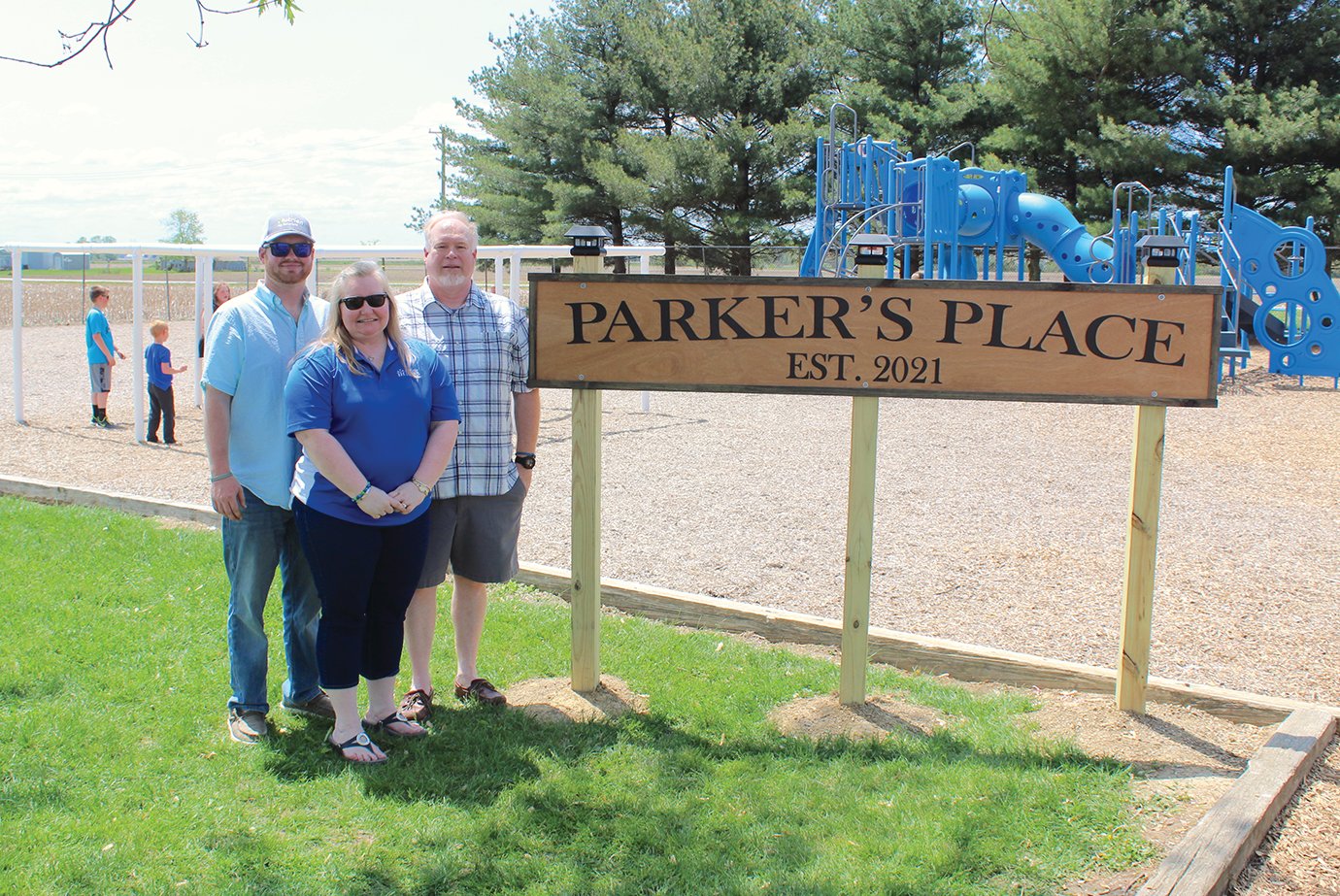Clinton Schroll, from left, Lenna Schroll and Jeffrey Schroll dedicate Parker’s Place on Friday at Walnut Elementary for son Parker Schroll who passed away in May last year following a fatal car crash. A 2020 Southmont graduate, Parker loved his days as a Walnut Flyer. A dedication ceremony was held Friday at the school in Parker’s honor, who would have thoroughly enjoyed the thought of bringing a lasting form of fun to both current and future Flyers, his mother said.