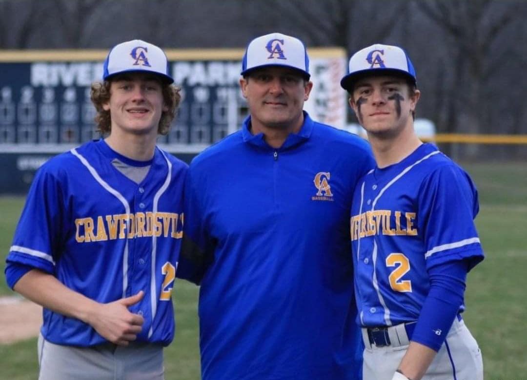 Crawfordsville head coach Brett Motz (center) is getting to coach both of his sons as freshman Wyatt Motz (left) and senior Austin Motz (right) are both performing well as the Motz family will remember this season for quite sometime.