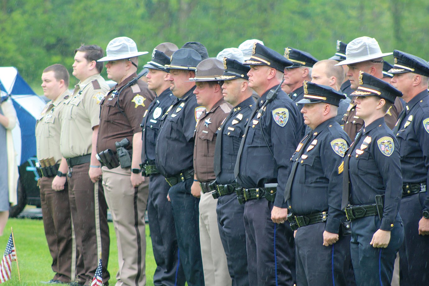 Officers and deputies from all branches of Montgomery County law enforcement honor the lives and service of fallen officers Lt. Russell Baldwin, Marshal Lesley Oaks and Marshal Mark Clapp Wednesday at Oak Hill and New Richmond cemeteries. The annual event has become a opportunity for county residents to honor all men and women who have paid the ultimate sacrifice for the public