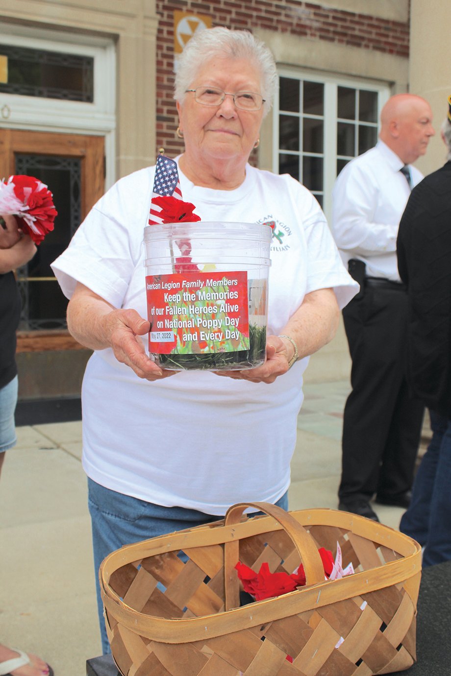 Auxiliary member Rosemary Hutchinson displays one of several donation jars.