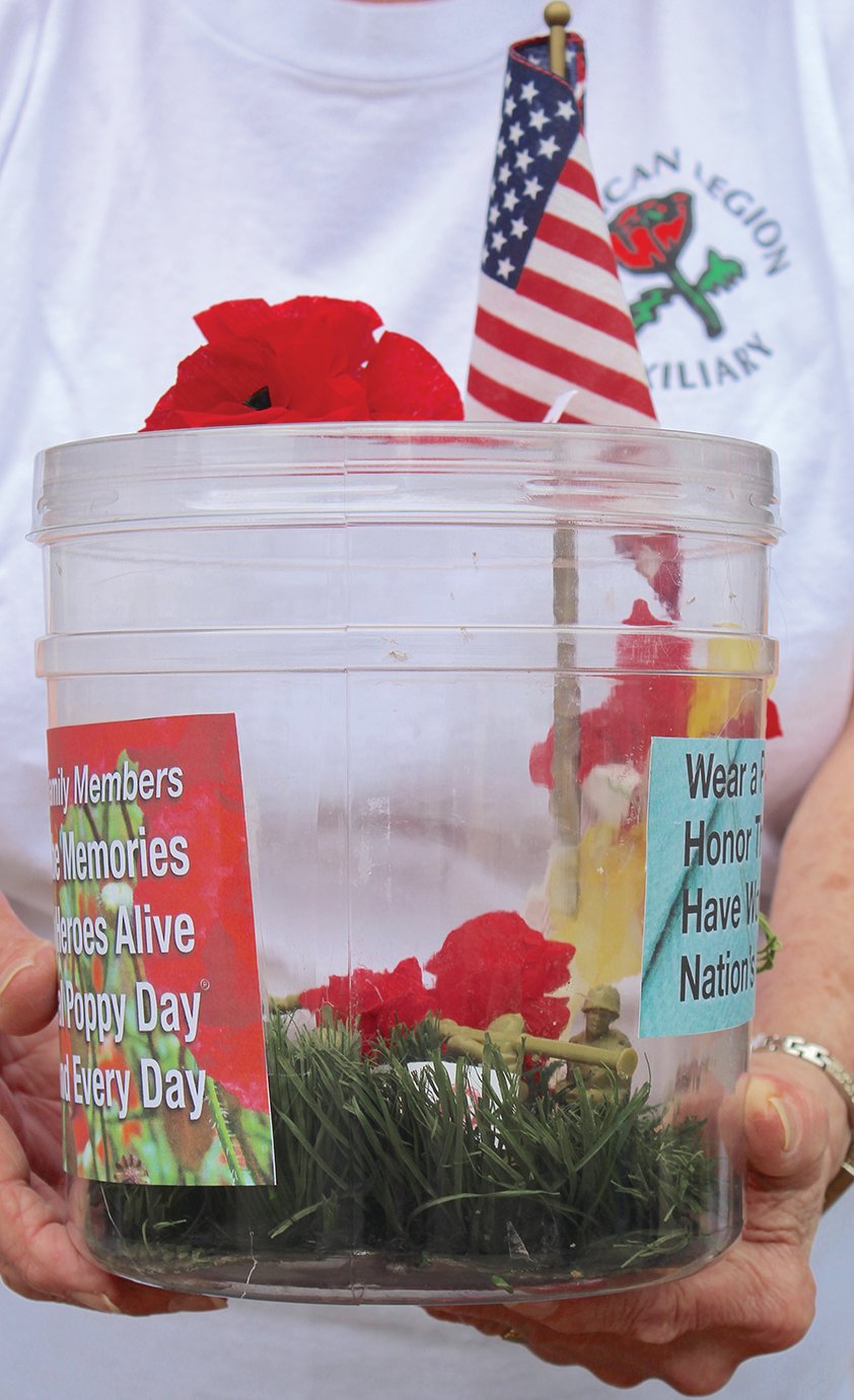 Donation jars featuring a microcasm of a soldier