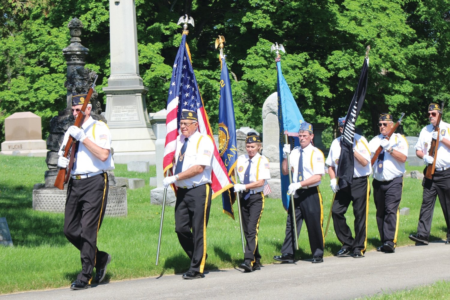 Members of the Crawfordsville American Legion Byron Cox Post 72 Honor Guard participate Monday in the annual Memorial Day service at Oak Hill North Cemetery.