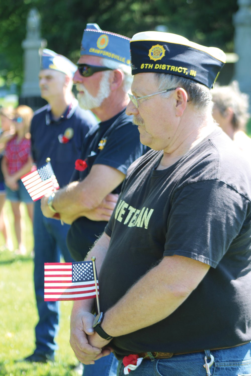 Veterans listen as Wayne Black delivers Monday’s featured speech during the Memorial Day service at Oak Hill North Cemetery.