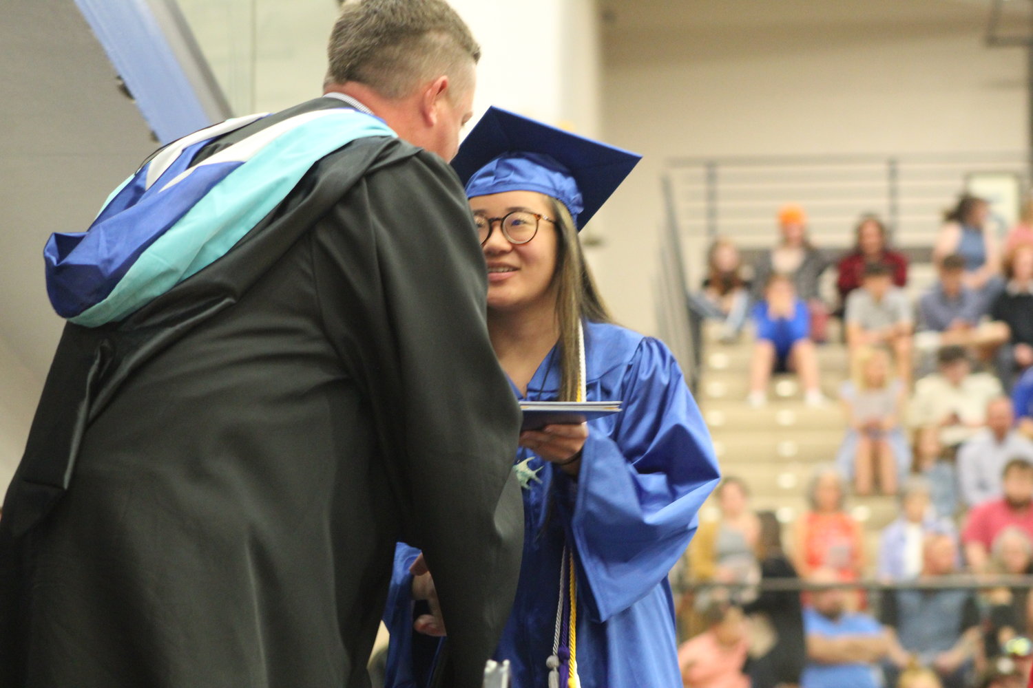 Lily Gobel receives her diploma from CHS principal Jay Strickland.