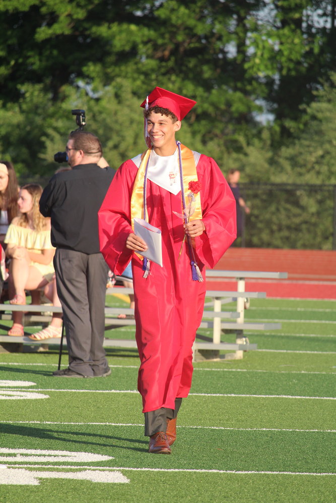 Avery Saunders walks back to his seat after receiving his diploma.