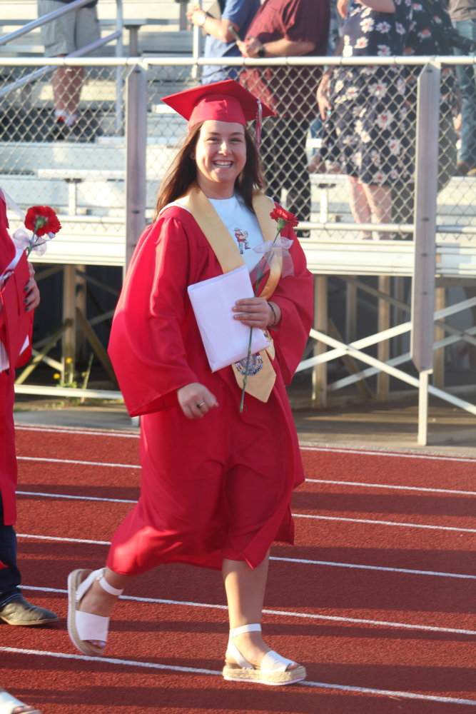 Madison Chadwick walks out of graduation with a big smile.