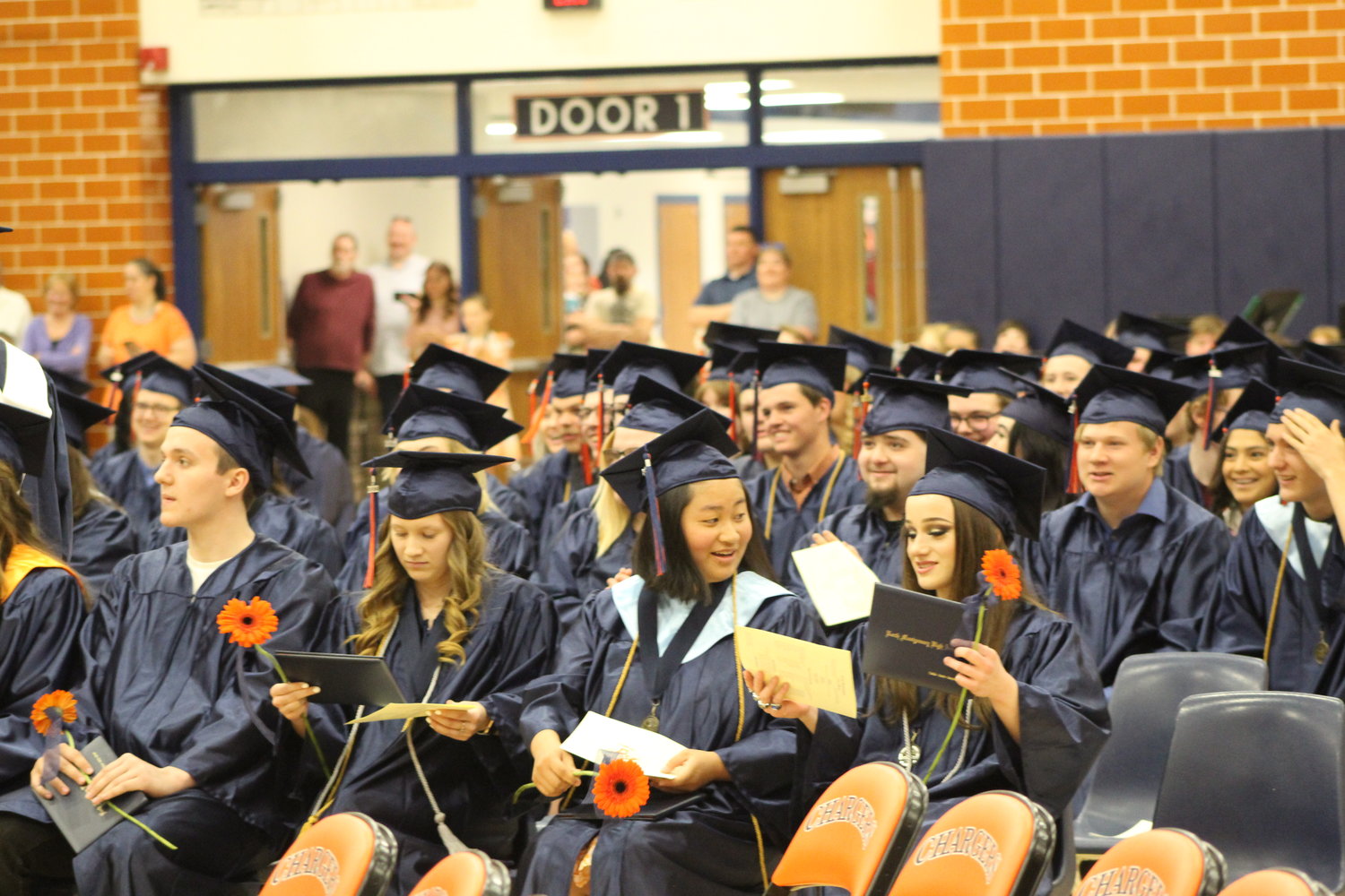 The Class of 2022 receive their diploma as well as a Charger Daisy which is the official flower of North Montgomery.