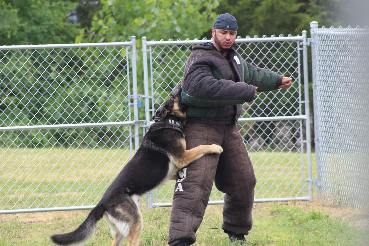 Crawfordsville Patrol Officer Michael Ives takes part in the aggression training course with fellow officer Michael Plant and his K-9, Barrett.