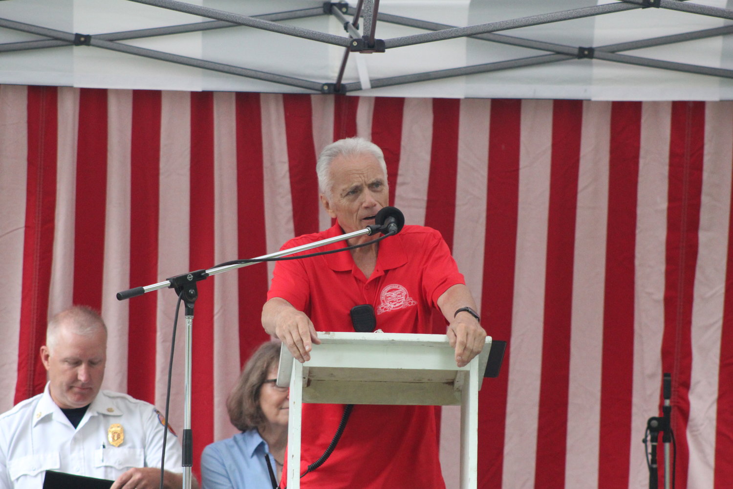 Strawberry Festival Chairman Dave Long introduces Crawfordsville Fire Chief Scott Busenbark during the annual “Hometown Heroes Salute” which took place on Friday.