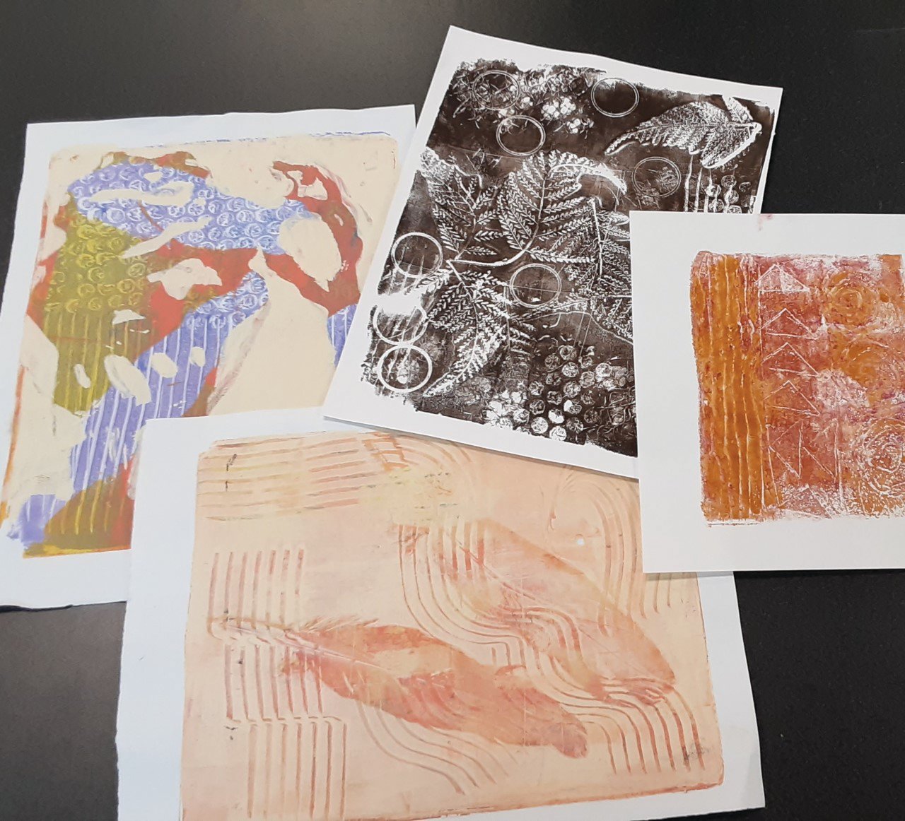A Gelli plate is a reusable printing surface that allows you to make monoprints. Simply roll acrylic paint onto a plate that is a clear gelatinous slab. The paint is then manipulated to create unique art.