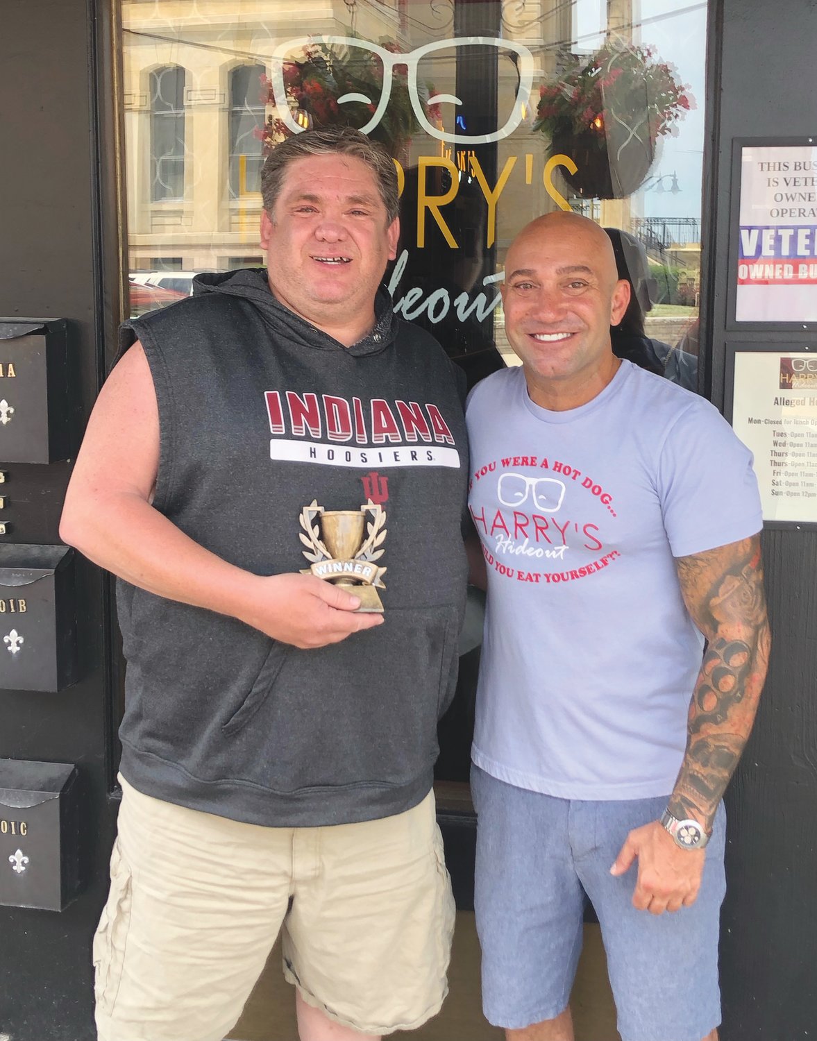Roy Walters, left, was the winner of the first-ever Harry’s Hotdog Eating Contest. He consumed eight hotdogs in five minutes. He is pictured with Harry’s owner Chris Stockdale.