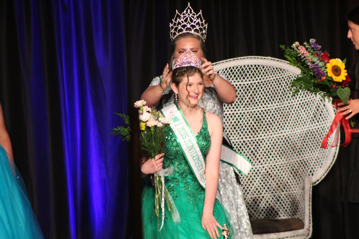 Miranda Crowe receives her Miss Princess crown from last year's Montgomery County Queen Morgan Meadows