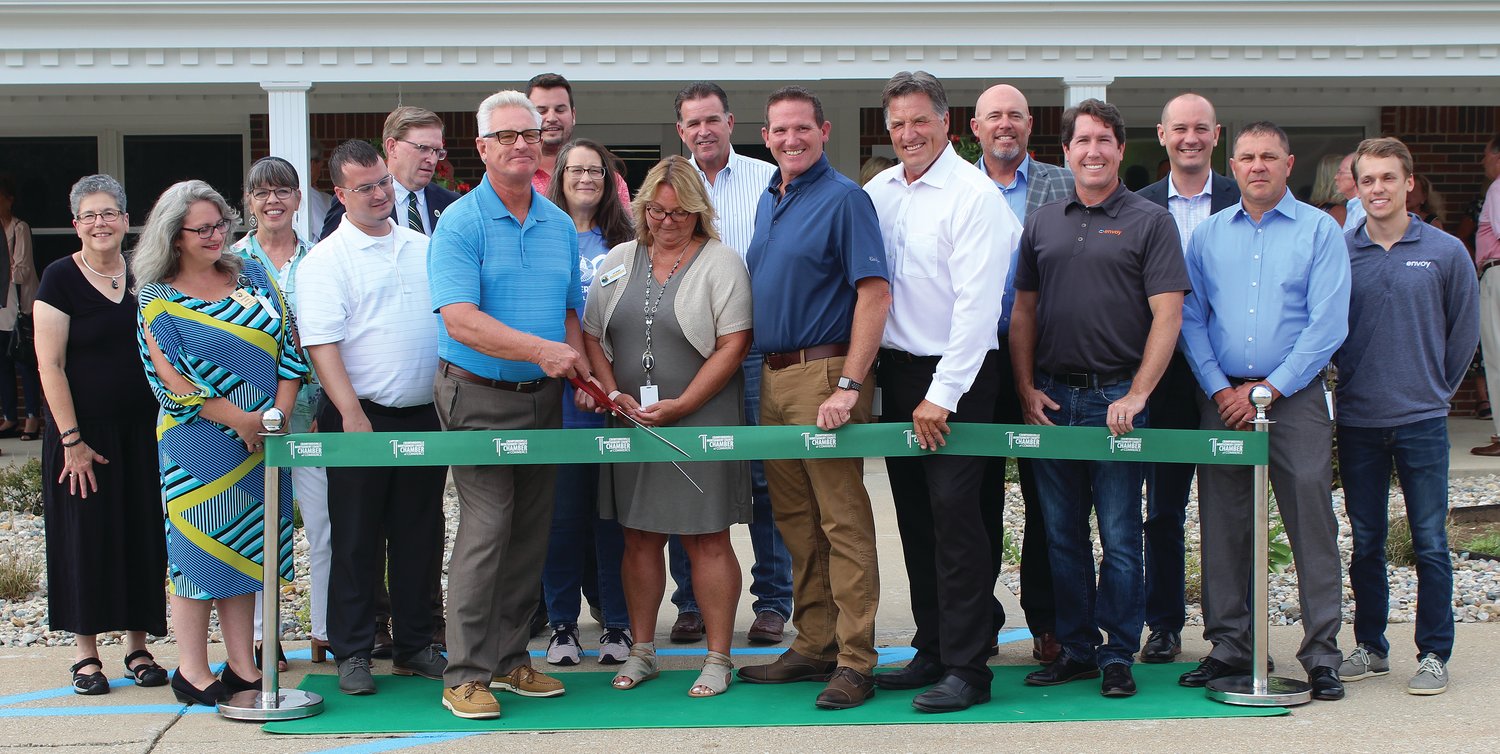 Local government officials, county staff members, local artists and others involved in the new county government center project pose Tuesday in front of the facility to cut the ceremonial ribbon. The project consisted of purchasing and remodeling the vacant Williamsburg Nursing Home to establish offices and meeting spaces for county government. The project started in August 2020 and county offices were moved in mid-March of this year. The $5.5 million project was financed through a bond by the Montgomery County Building Corp. County offices located in the center include assessor, auditor, building/zoning, commissioners, engineering, health, mapping, maintenance, recorder, surveyor, treasurer and veteran services.