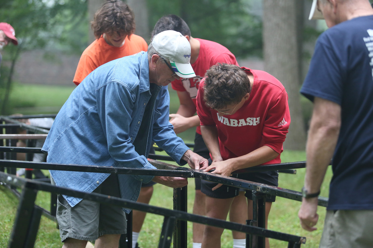 First-year Wabash College students helped hang strings of lights, move picnic tables and trash receptacles and built the entertainment stage for the annual Taste of Montgomery County.