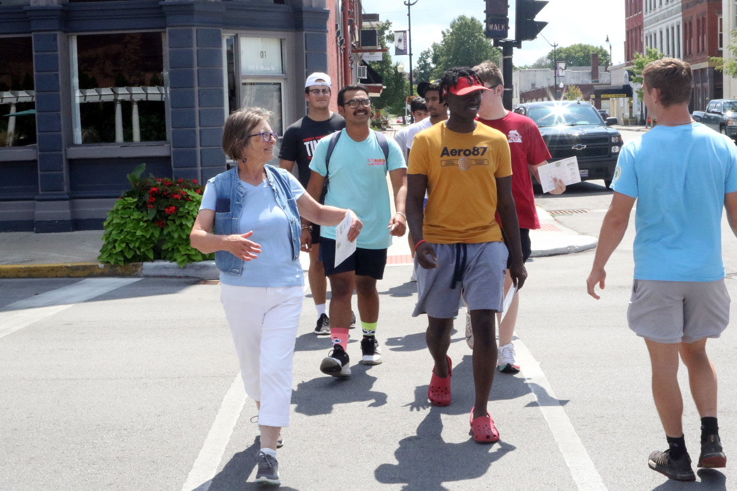 Helen Hudson leads students on a walking tour of downtown.