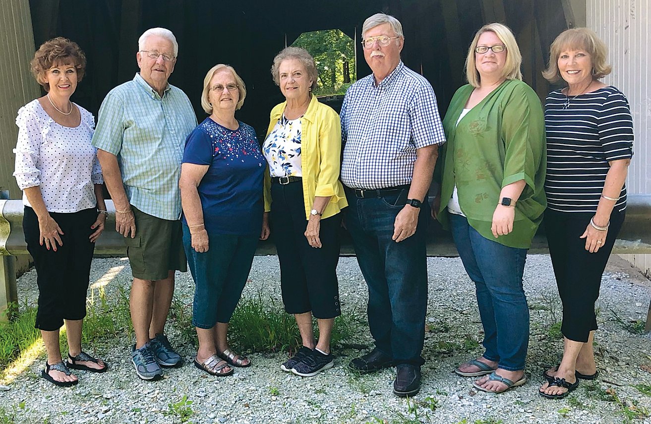 Pictured at the Cade's Mill Covered Bridge are, from left, Dorothy Q Chapter Regent Michele Borden, Fountain County Art Council President Jim Hegg and wife Barbara, Fountain County Historian Carol Ann Freese, Fountain County Art Council Chairman Henry Schmitt, Special Project Coordinator Andrea Campbell Ingram and Dorothy Q Chapter Past Regent Susan Fisher.