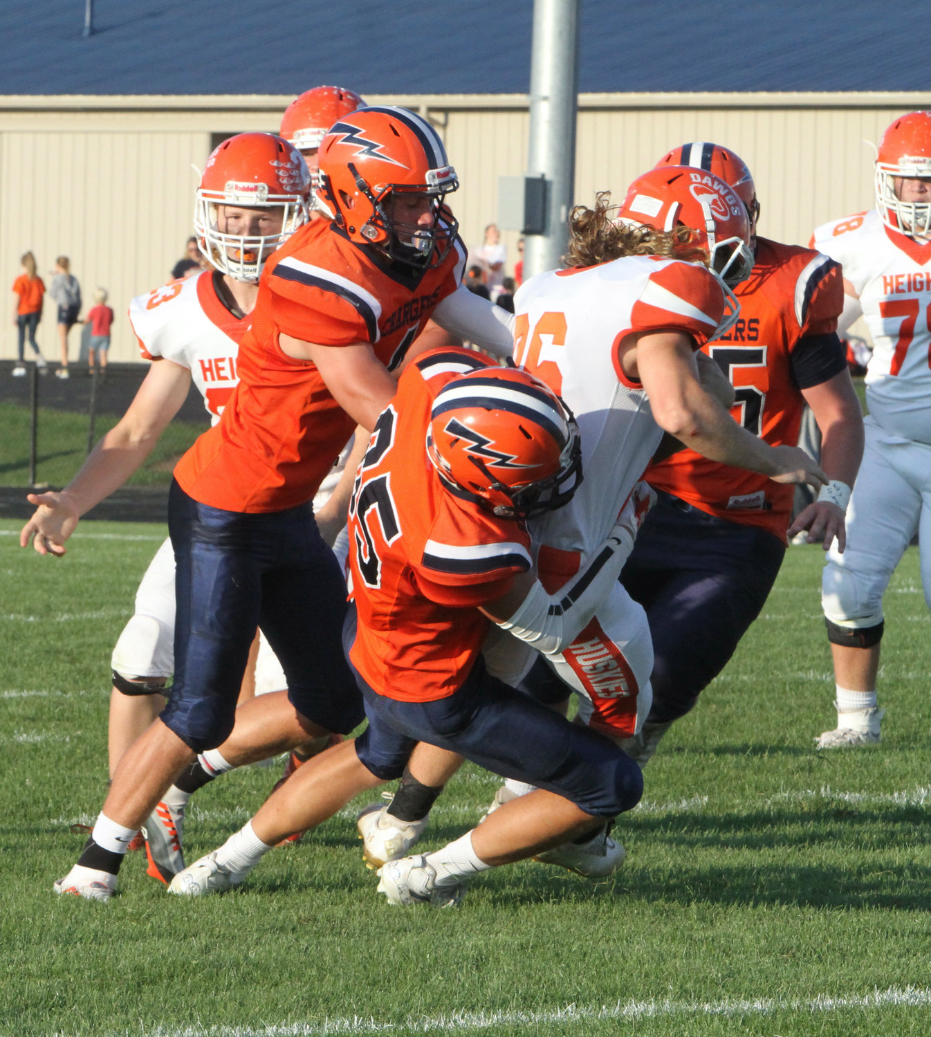 The North Montgomery defense swarms the Husky ball-carrier for the tackle.
