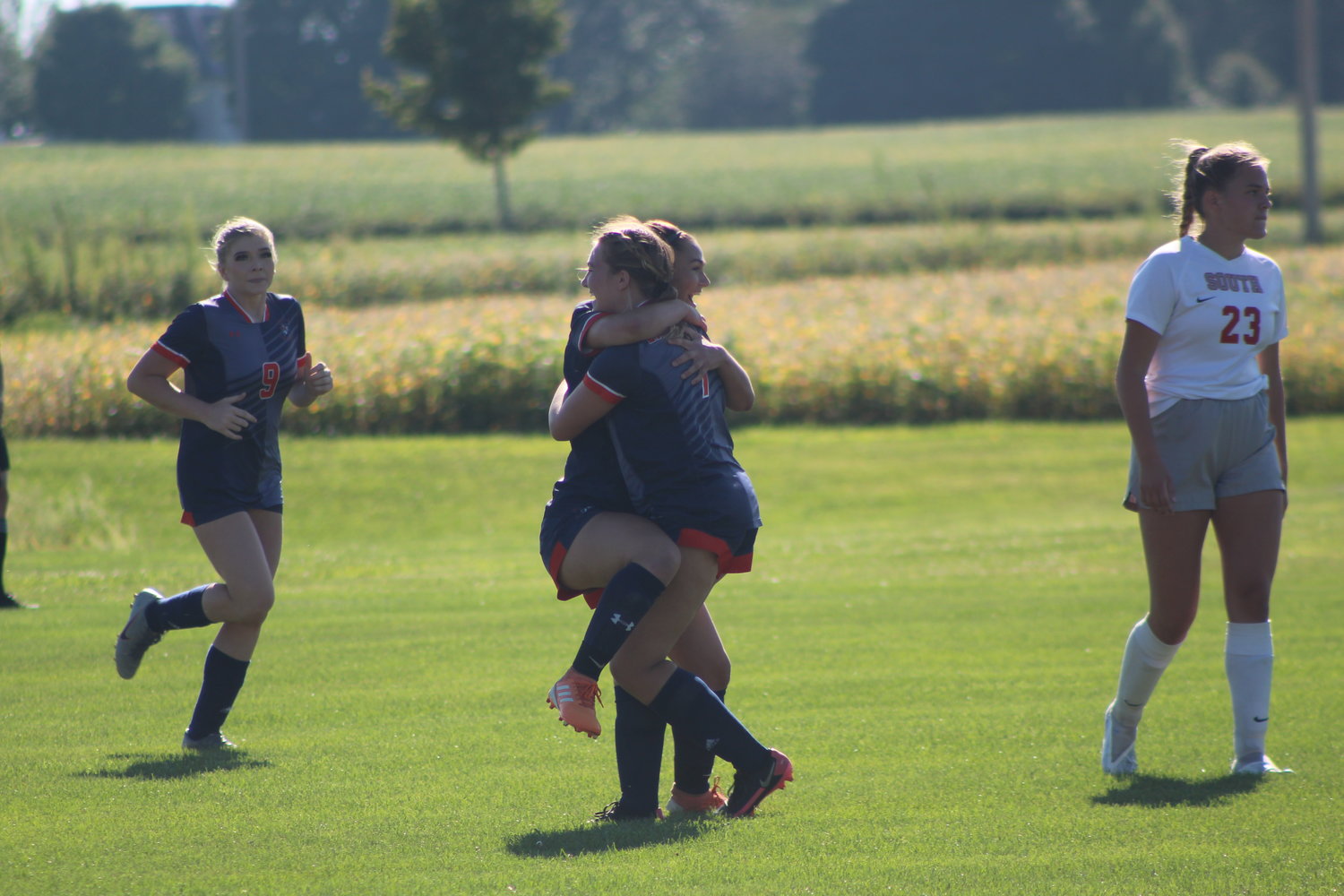Teegan Bacon celebrates one of her two goals with her teammates against county rival Southmont.