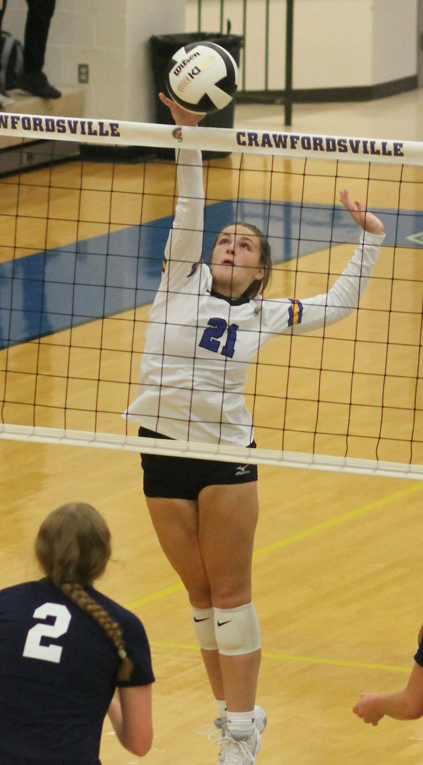 Kaydence Brost looks to secure the kill for the Athenians.