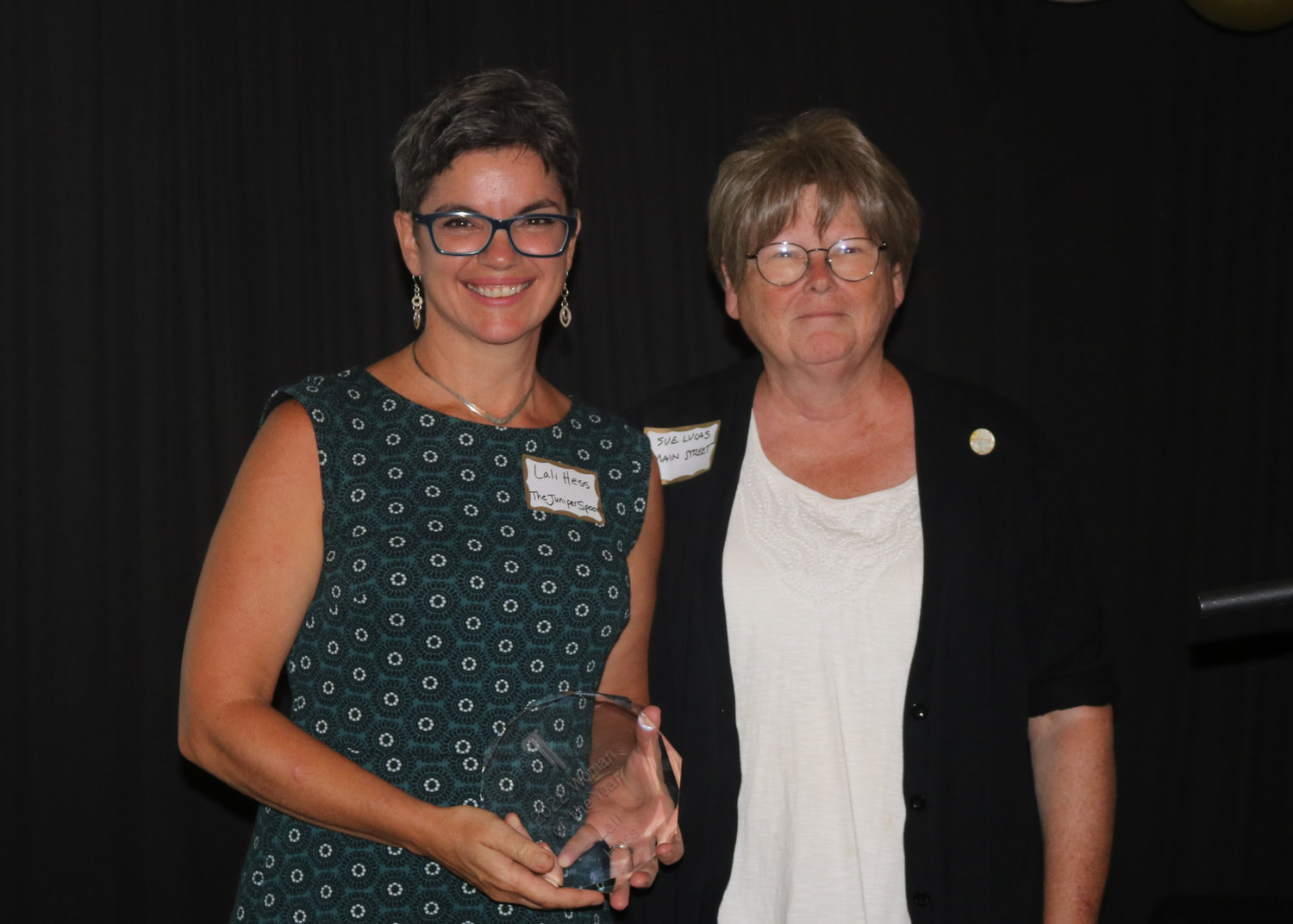 Lali Hess, left, of Juniper Spoon, was named Woman of the Year. She is pictured with Sue Lucas.