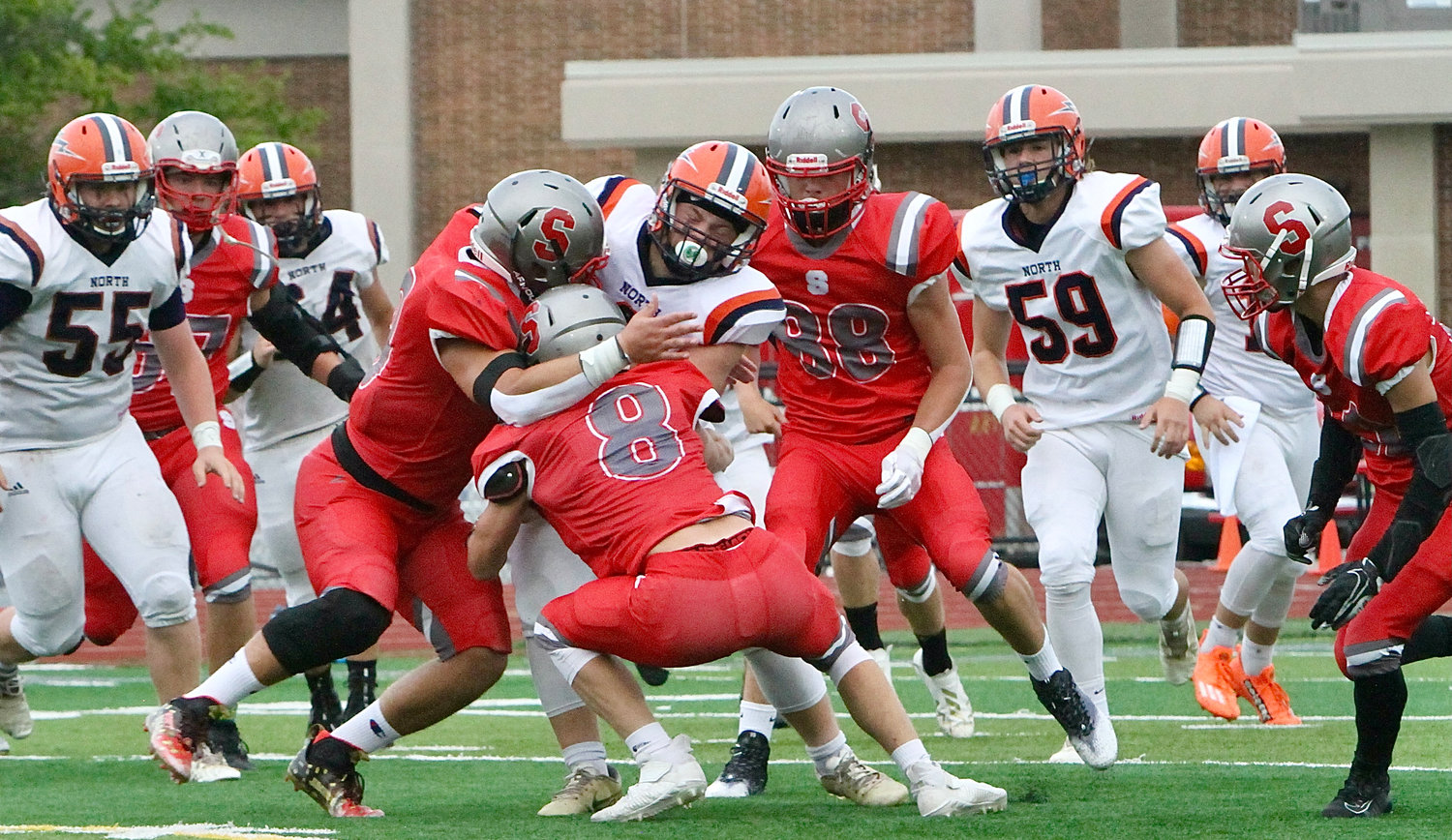Southmont's defense bring down Charger quarterback Ross Dyson for a sack.
