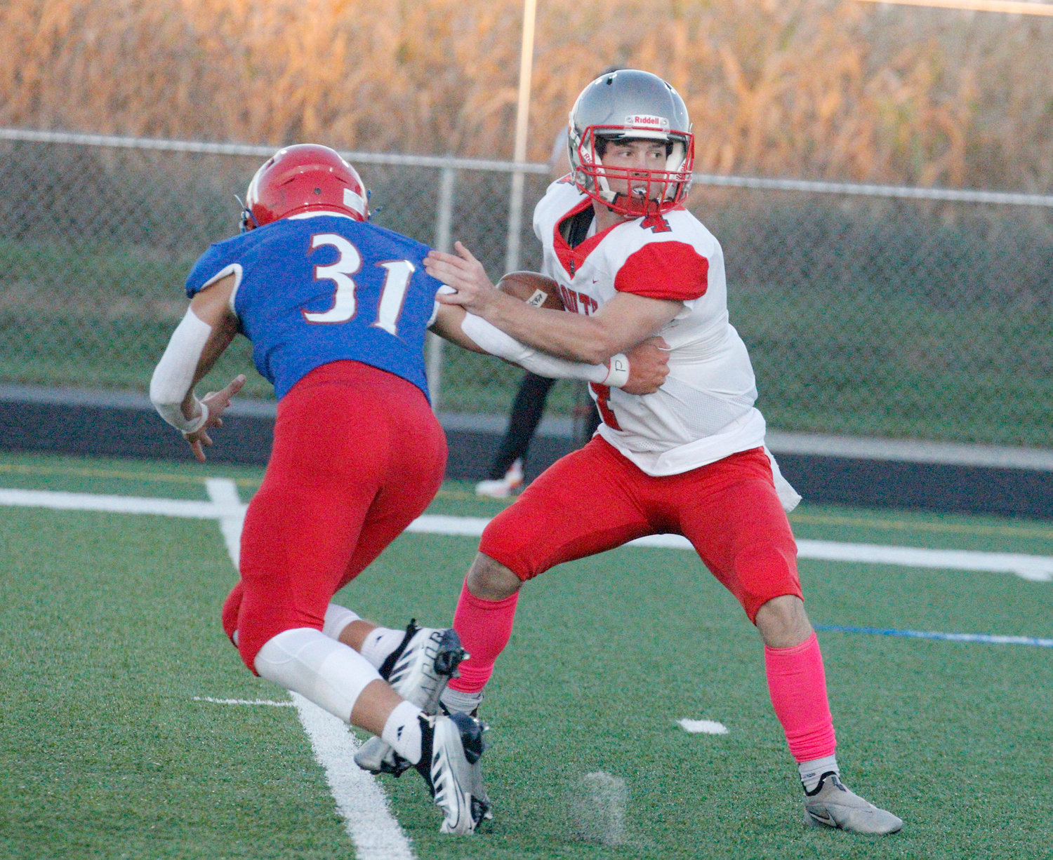 Southmont quarterback Nick Scott evades a pass rusher during the Mounties 38-7 loss against Western Boone.