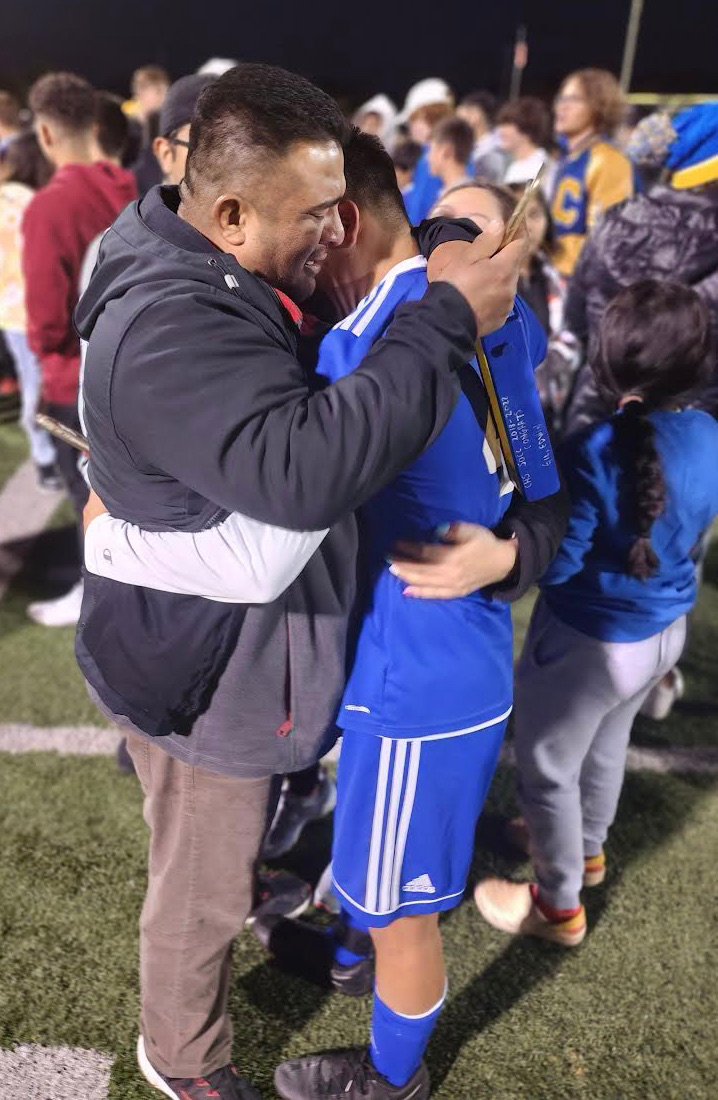 Jazier Gil-Herrera and his family celebrate the sectional title. Gil-Herrera has the two penalty kicks in the second half to give CHS the lead.