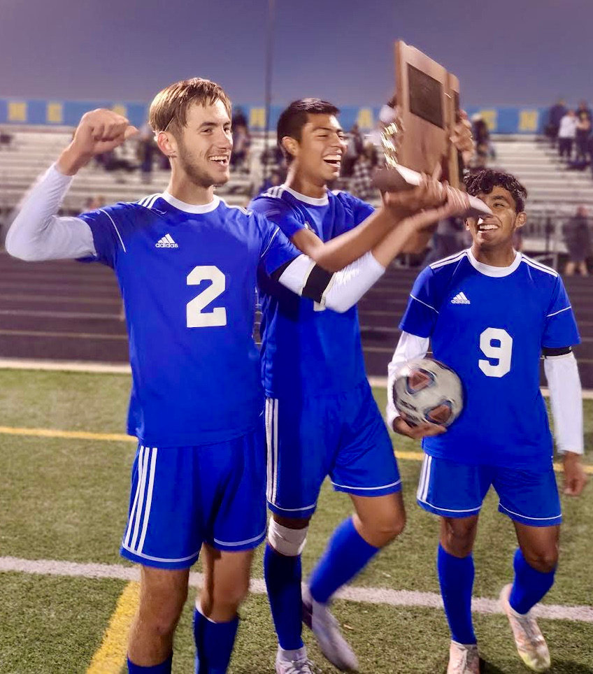 Captains Patrick Corado, Andrew Jones, and Yeison Cifuentes hold receive the 2022 sectional championship trophy.