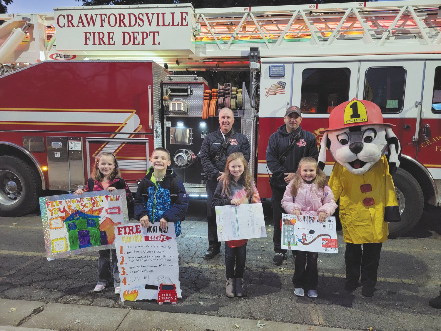 The Crawfordsville Fire Department conducted  a poster contest for Fire Prevention Week. Four winners from Nicholson' Elementary School got to ride to school in a fire truck Friday. The theme this week won't "Fire Won't Wait, Plan your Escape." Students pictured, from left, are Avery Sarver, Bronson Fergason, Aimee Kimbro and Emma Bishop.