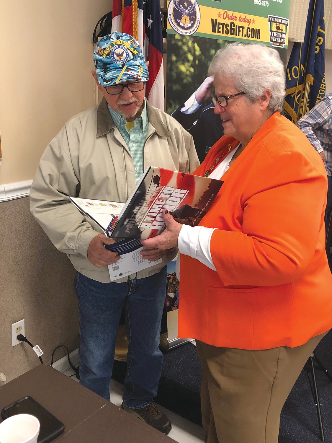 A member of the Dorothy Q Chapter of the Daughters of the American Revolution helps greet a veteran at the annual Veteran Expo.